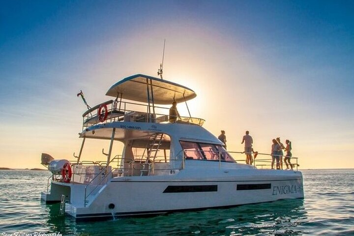 A relaxing evening on the water invites travelers to toast as the sun sets behind iconic Table Mountain with the scenic beauty of Cape Town serving as the perfect backdrop.